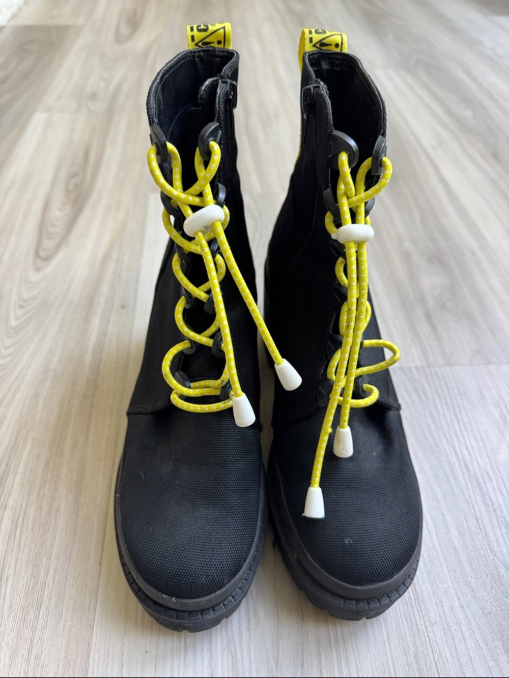 Steve Madden Block Heel
Booties Brawler Combat Boot
Black and Yellow Bungee 8